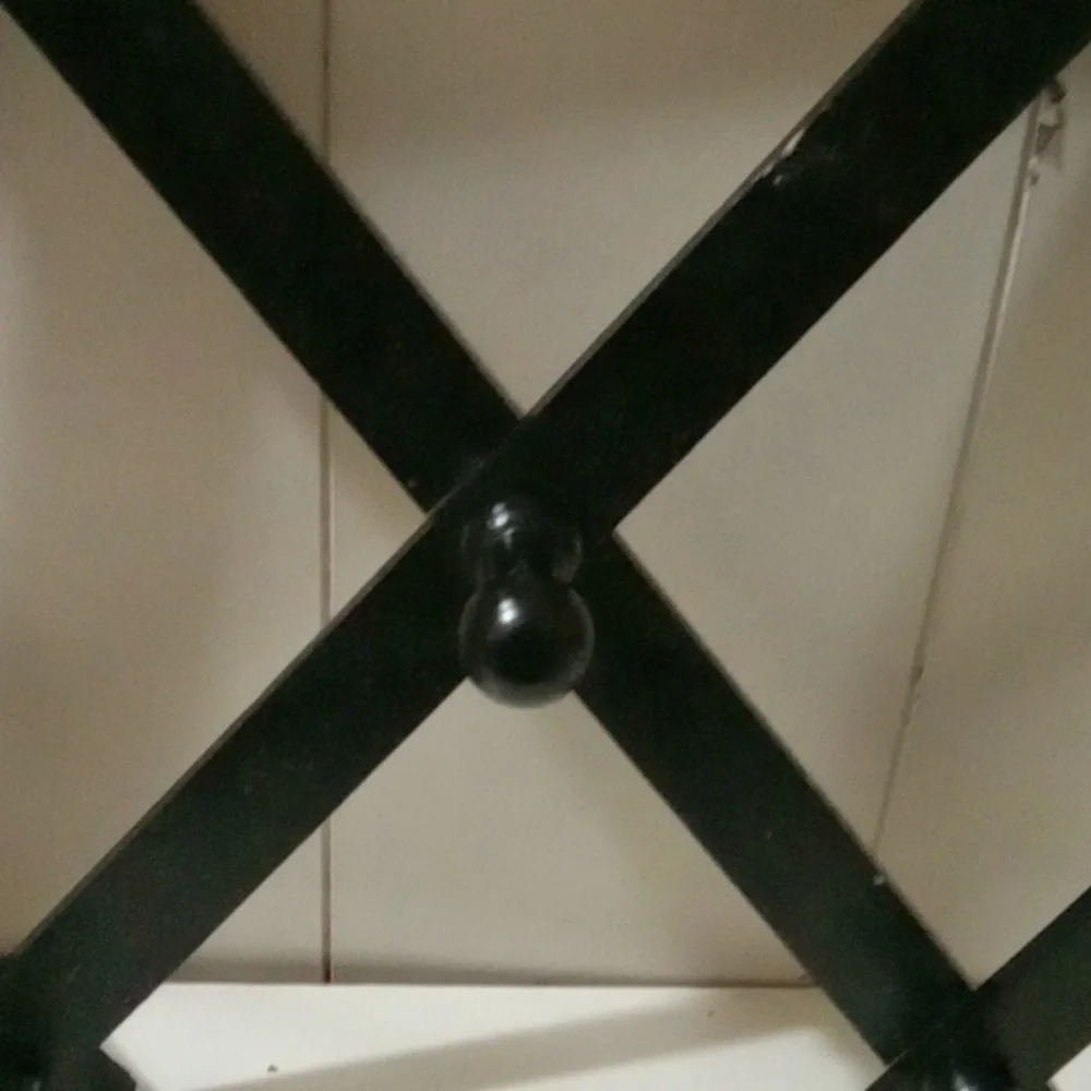 Black Wall-Mounted Coat Rack.